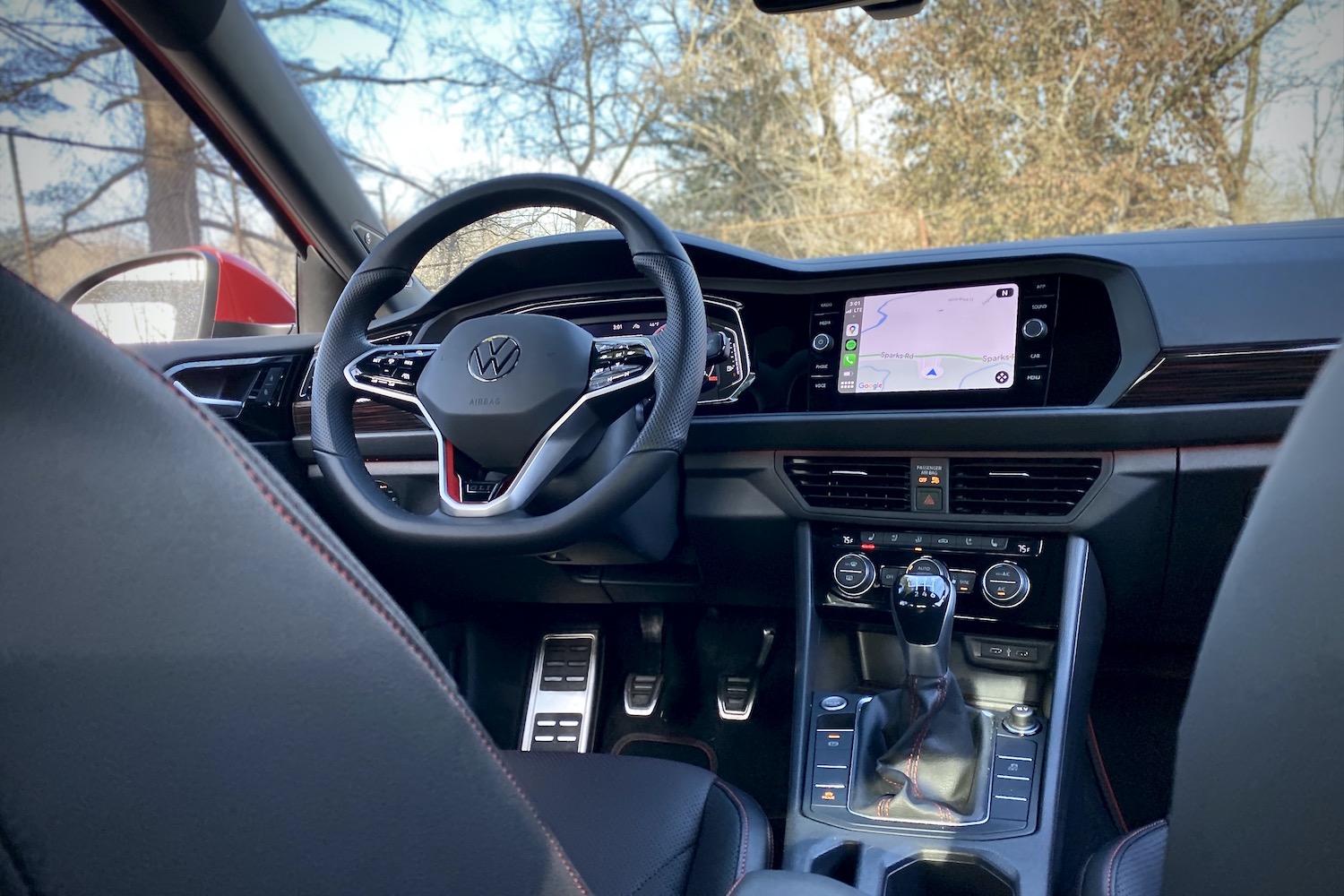 2022 Volkswagen Jetta GLI steering wheel and center console from rear seats.