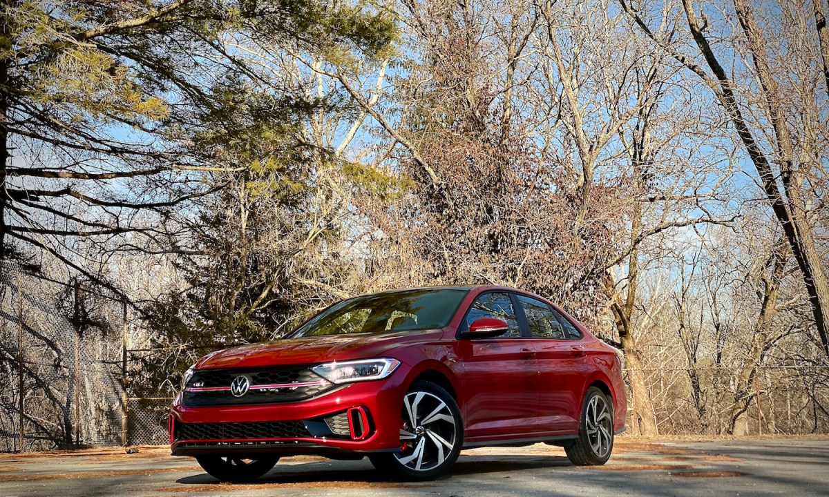 2022 Volkswagen Jetta front end from driver's side with trees in the background.