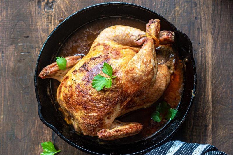 Roasted chicken in a pan.