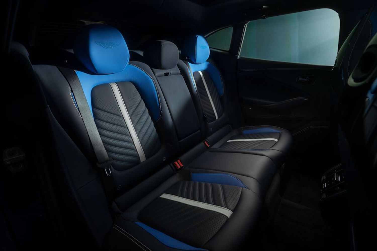 Rear seats in the Aston Martin DBX 707 in a dark warehouse.