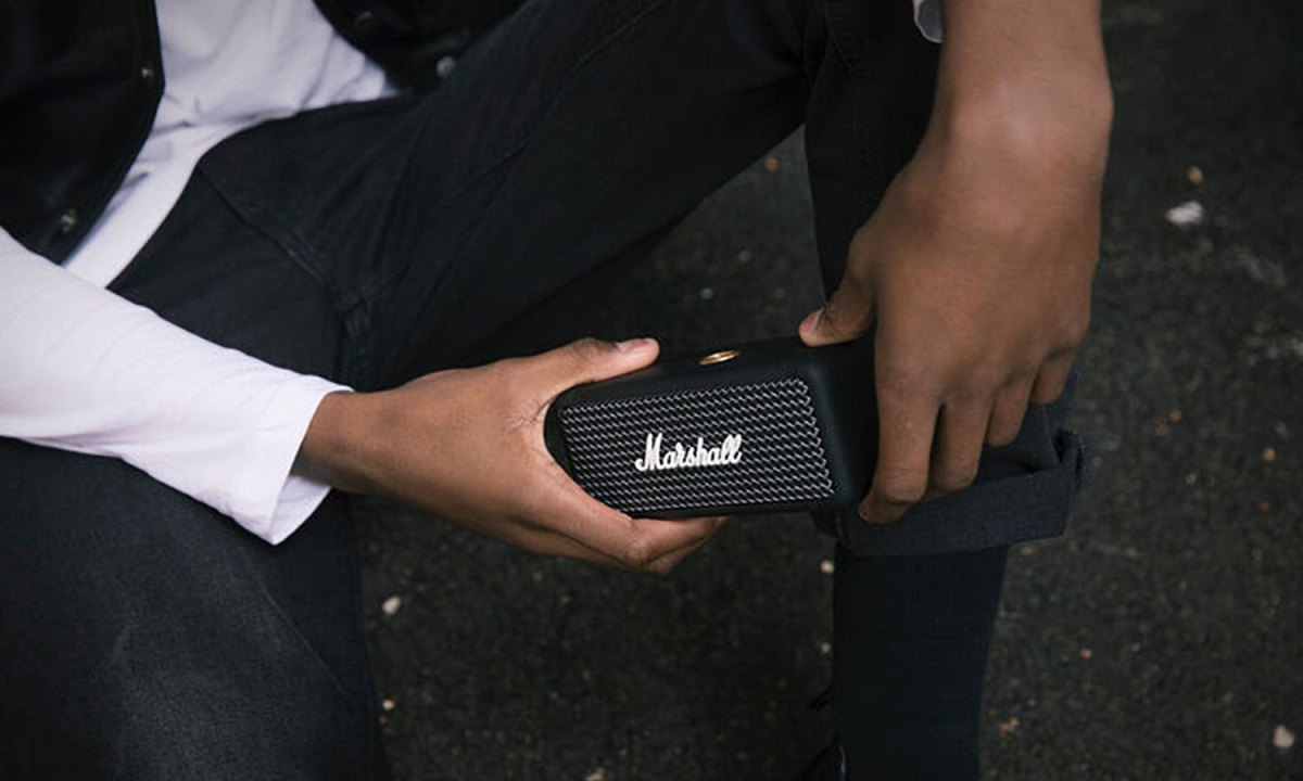 Man holding Marshall's Emberton portable speaker.