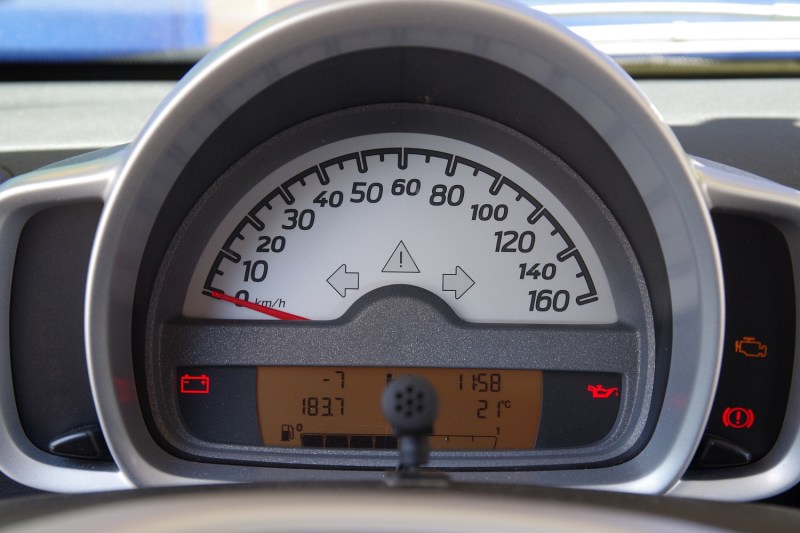 Car warning light on a vehicle dashboard.
