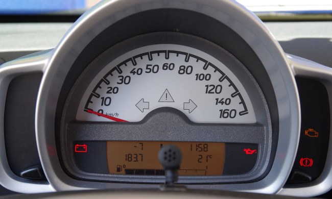 Car warning light on a vehicle dashboard.