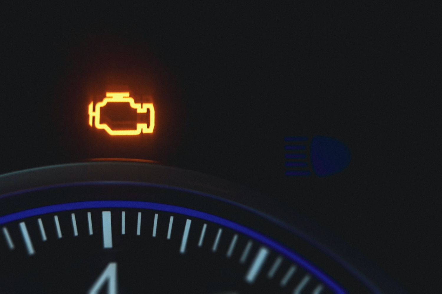 Check engine light on a car dashboard.