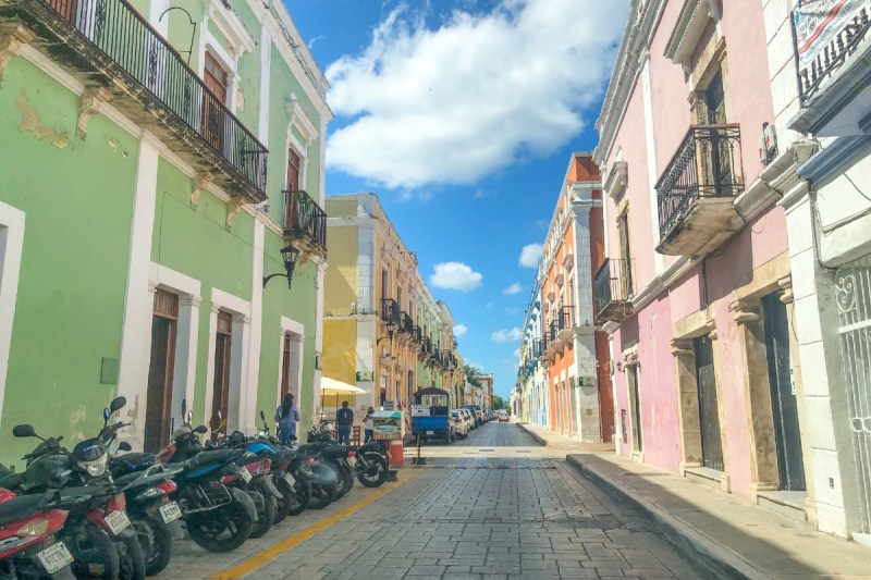 A street in downtown Campeche with motorcycles.