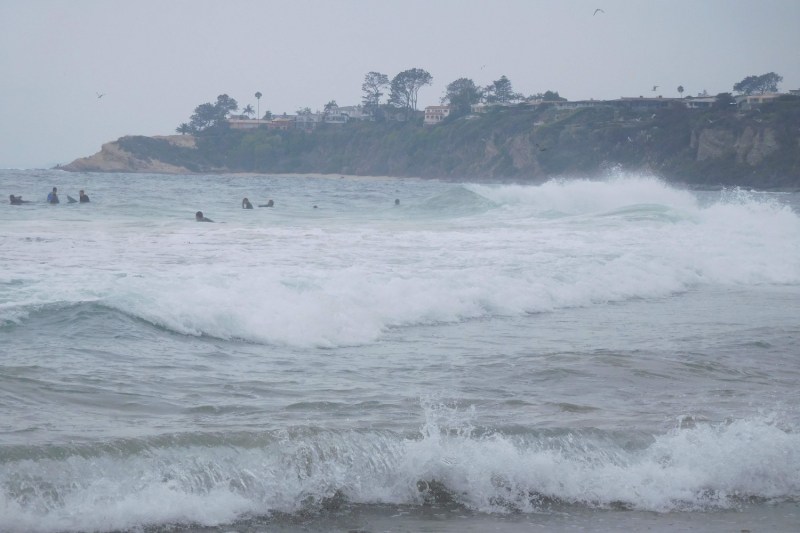 Surfers in the water at Salt Creek Beach in Dana Point, California.