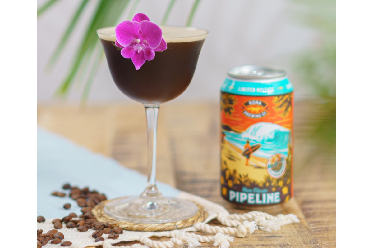 Kona Pipeline porter espresso martini with purple flower garnish next to kona porter beer.