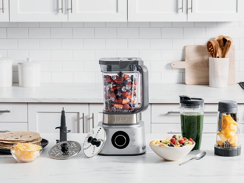 Ninja Foodi Ultimate System on a white marble kitchen counter.