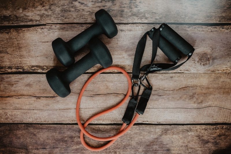Pair of dumbbells and a resistance band with handles.