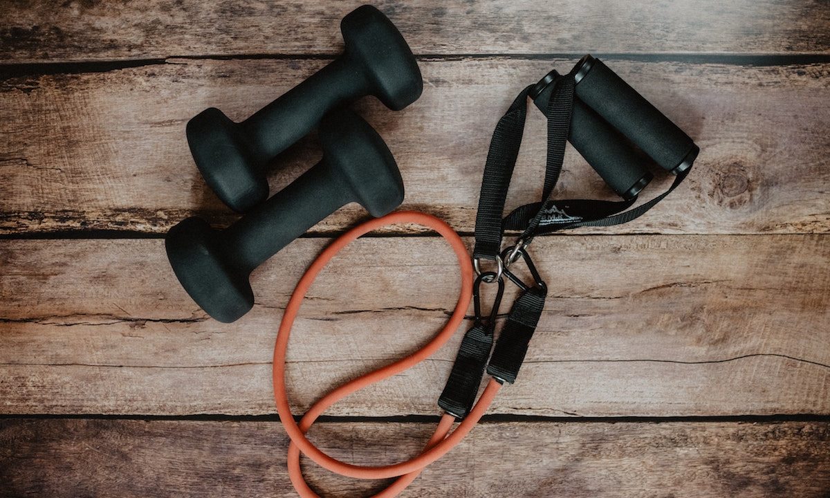 Pair of dumbbells and a resistance band with handles