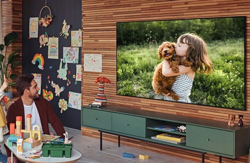 Family watching videos on Samsung 55-inch Class Q60A 4K TV.