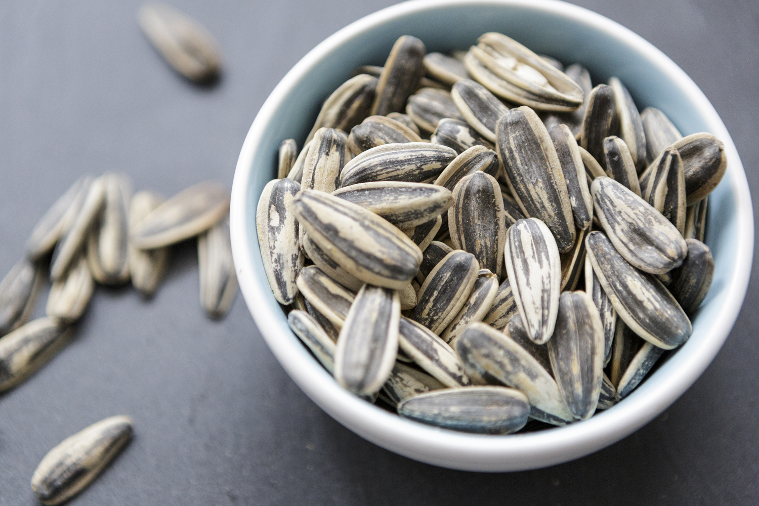 A bowl of sunflower seeds.