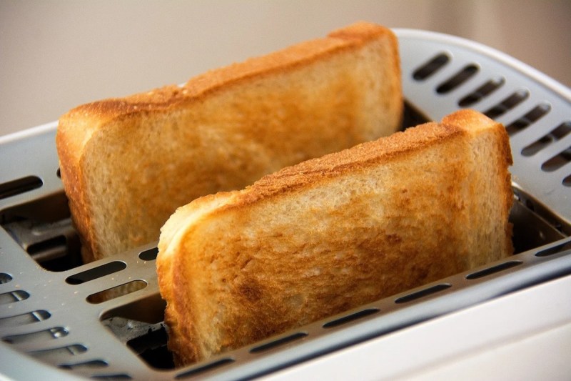 Toast coming out of a toaster.