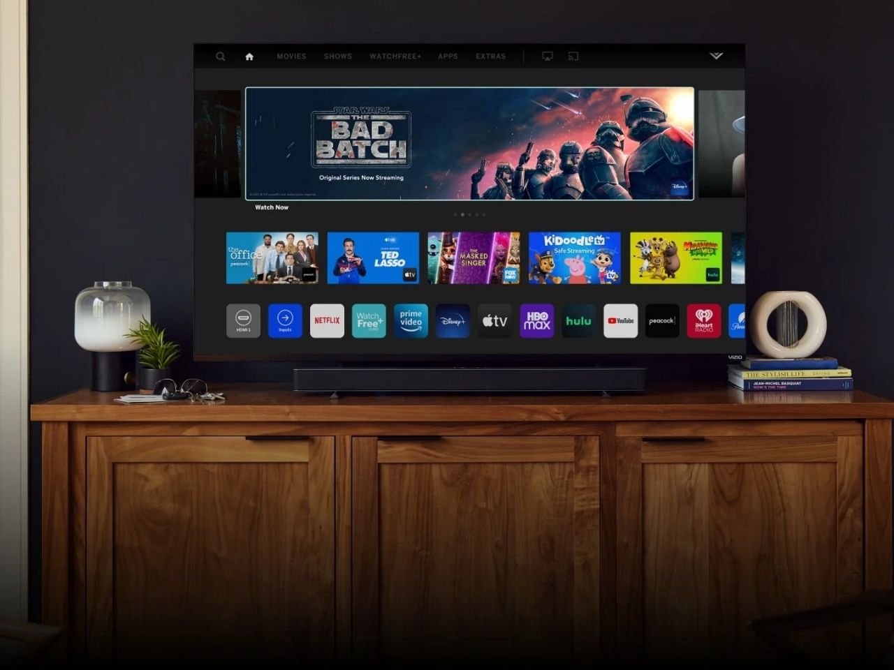 Vizio 70-inch M7 4K TV on TV table.