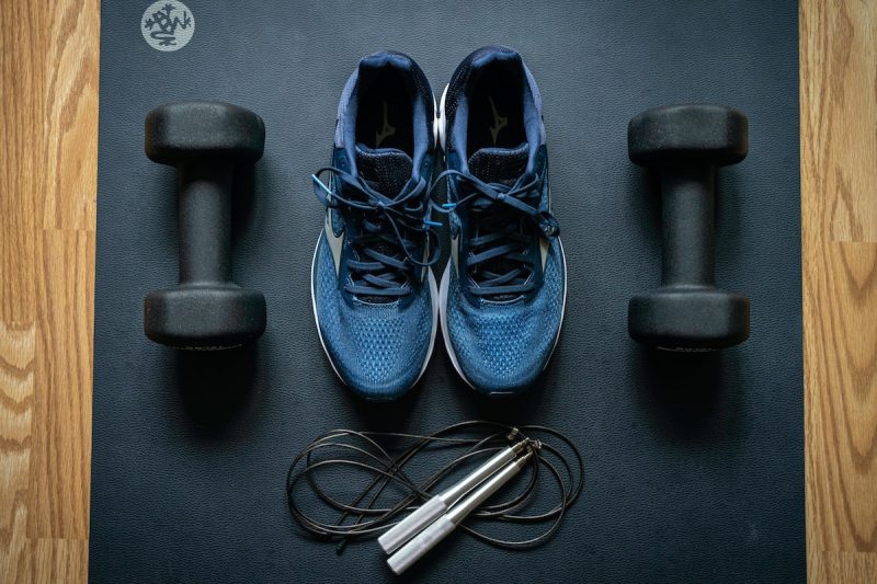 Workout gear: jump rope, shoes, mat, and weights