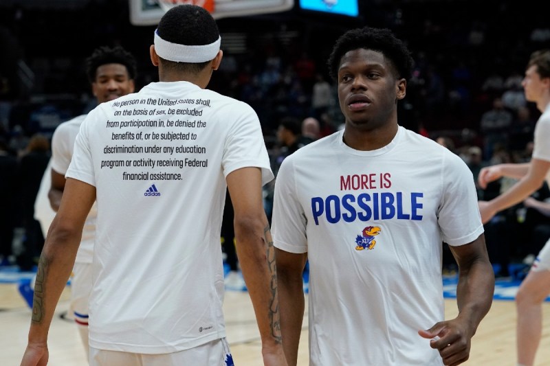 Kansas University Jayhawk basketball players wearing the new Adidas 'More Is Possible' warmup shirts.
