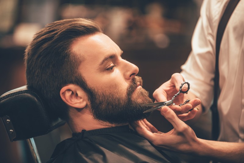 Man having his beard trimmed