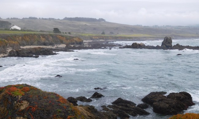 A view of the waves and the mountains at Pescadero State Beach in Pescadero, California.