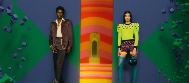 Gucci models stand at the entrance to the Vault, the luxury apparel company's new metaverse venture offering vintage goods.