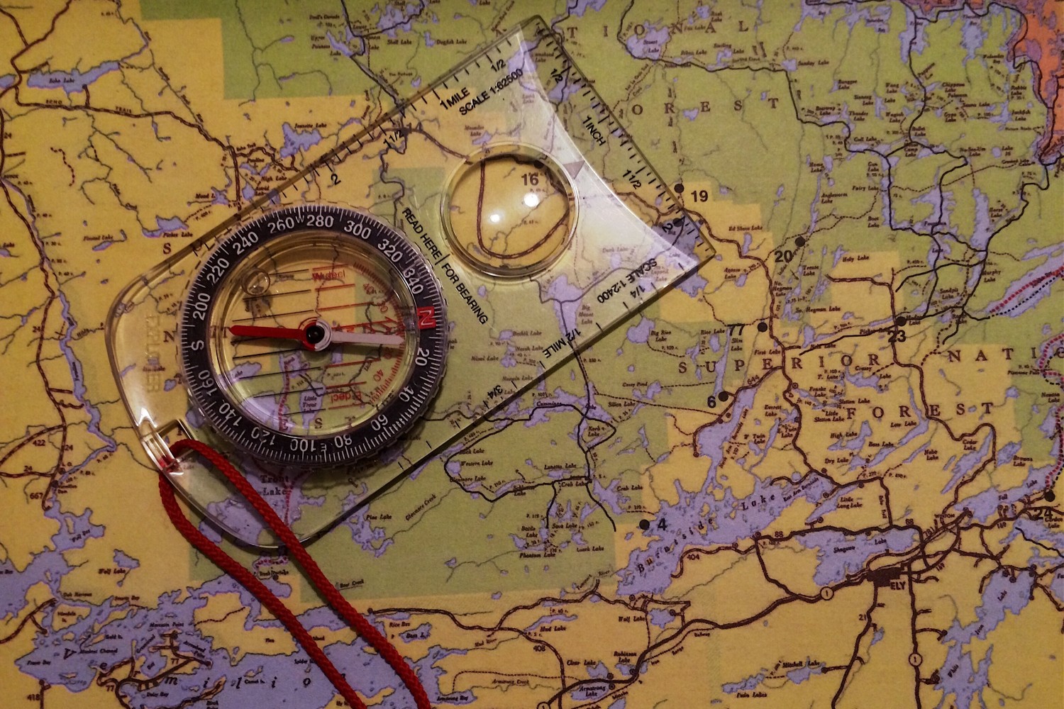 A compass and a map being used.