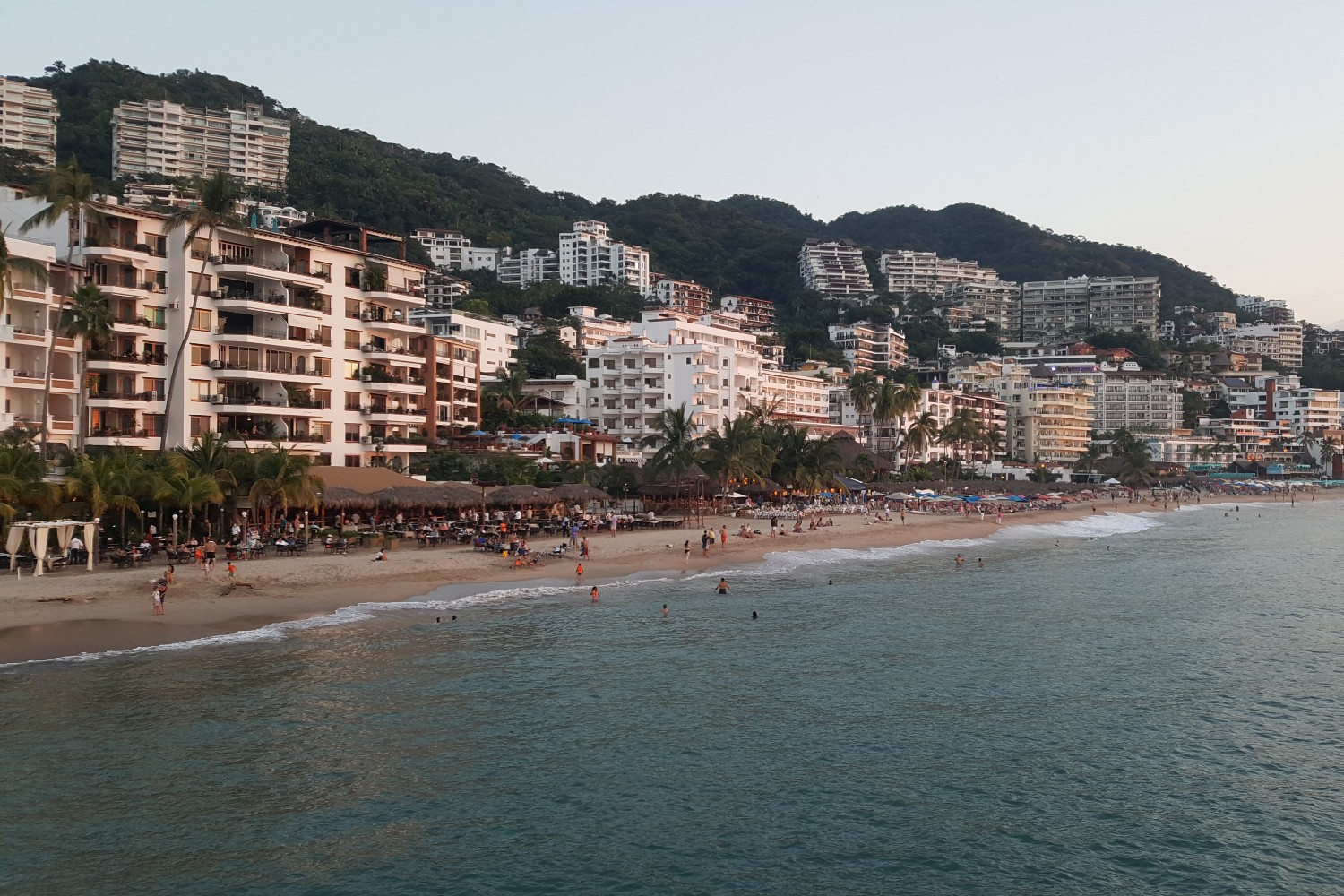 A view of the beach, hotels, and the mountains in Puerto Vallarta, Mexico.