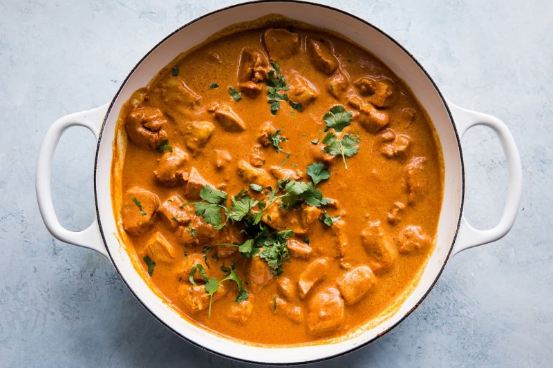 Overhead shot of a pot of butter chicken.