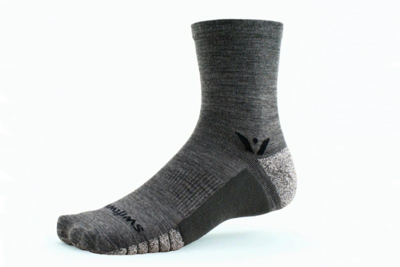 Swiftwick flite xt performance socks on a white background.