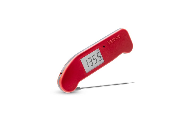 A red ThermoWorks Thermapen ONE on plain background.