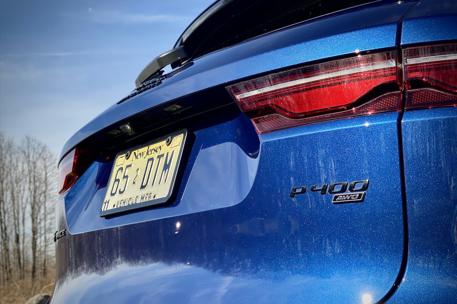 Close up of rear end of 2022 Jaguar F-Pace R Dynamic S with blue sky in the background.