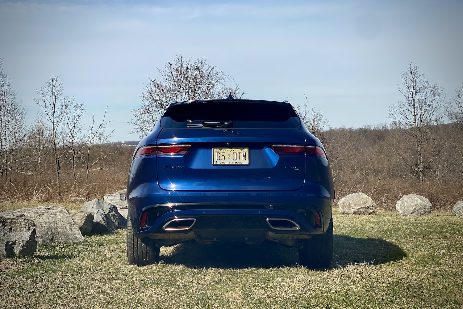 Rear end of 2022 Jaguar F-Pace R Dynamic S with rocks in the background.