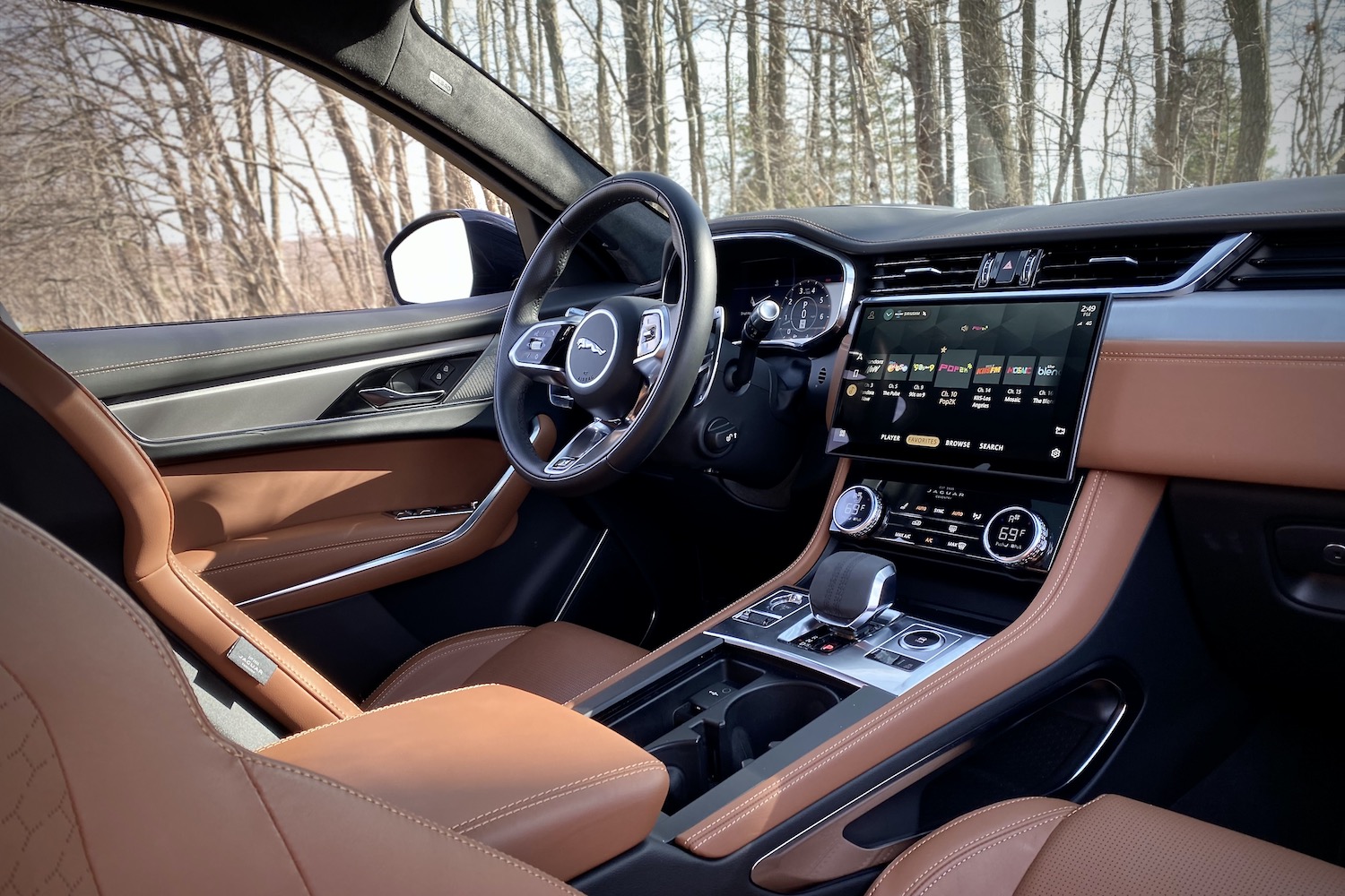Steering wheel and dashboard in 2022 Jaguar F-Pace R Dynamic S from passenger's side.