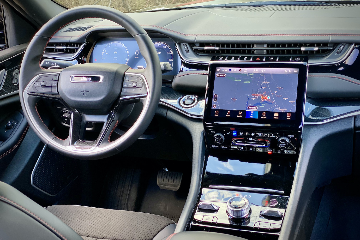 Close up of 2022 Jeep Grand Cherokee Trailhawk center console from rear seats.