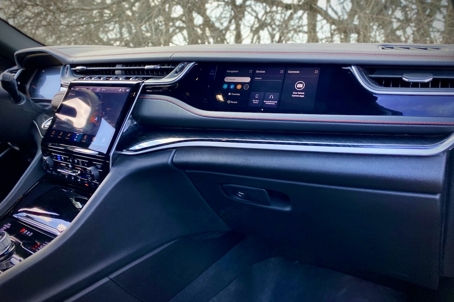 Passenger monitor in 2022 Jeep Grand Cherokee Trailhawk from passenger's side.