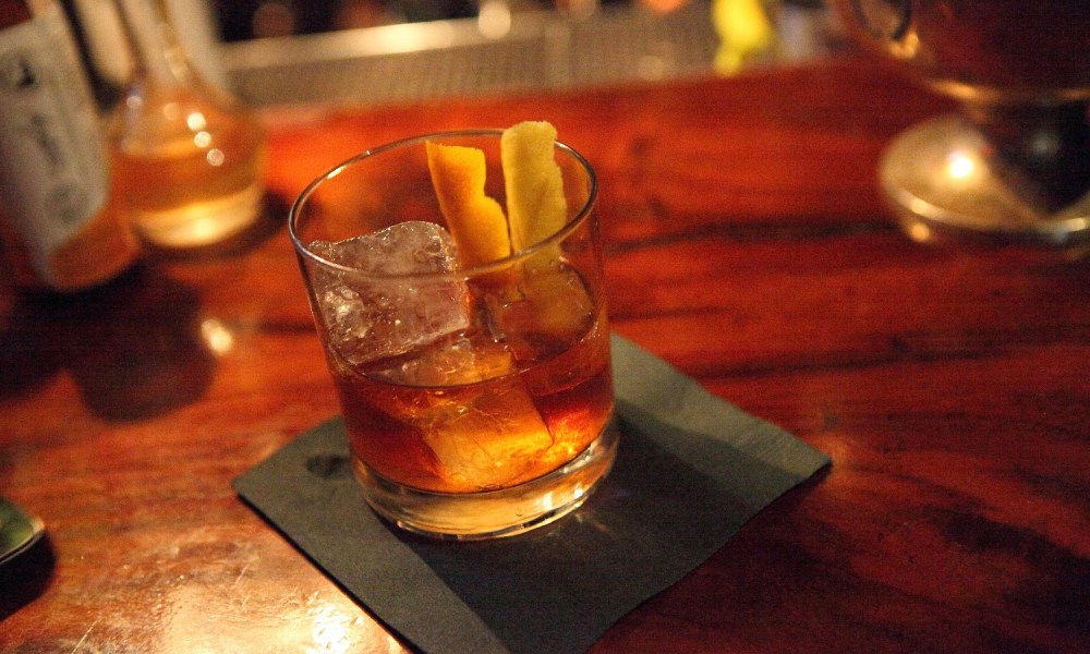 An Old Fashioned whiskey cocktail at a bar