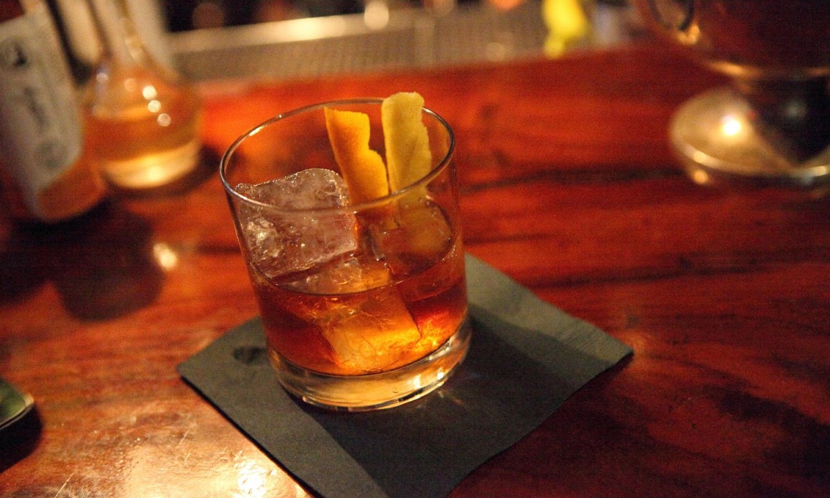 An Old Fashioned whiskey cocktail at a bar