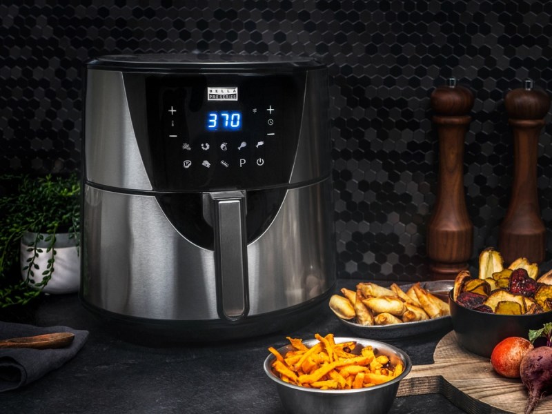 The Bella Pro Series 8-Quart Digital Air Fryer with some fried food at the side.