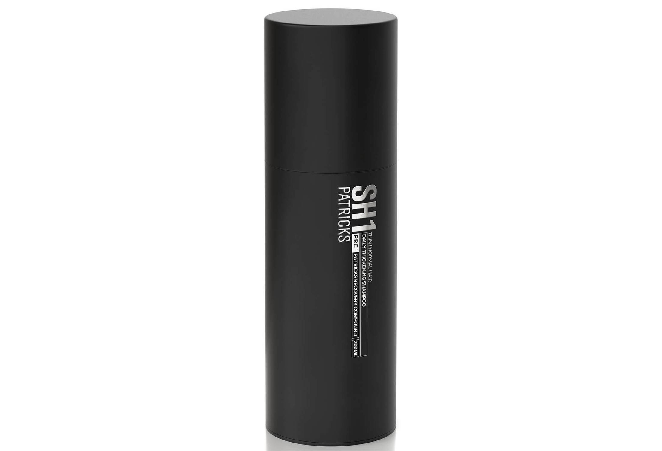 A bottle of Patricks Daily Thickening Shampoo.