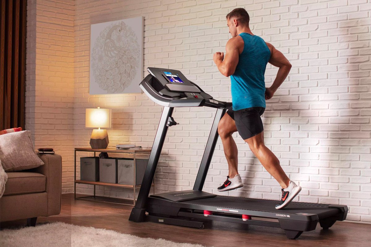 A man runs on ProForm Carbon TL smart treadmill.