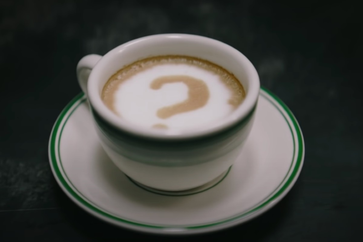 The Riddler's signature question mark drawn into a cup of coffee in 'The Batman' film