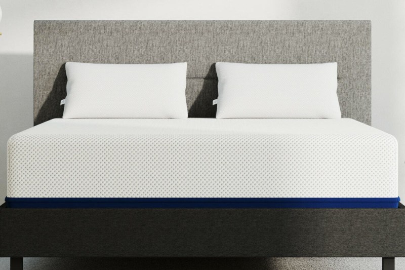 amerisleep as5 mattress on a bedframe with two pillows.