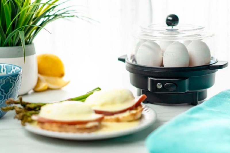 The Bella egg cooker with a plate of eggs benedict.