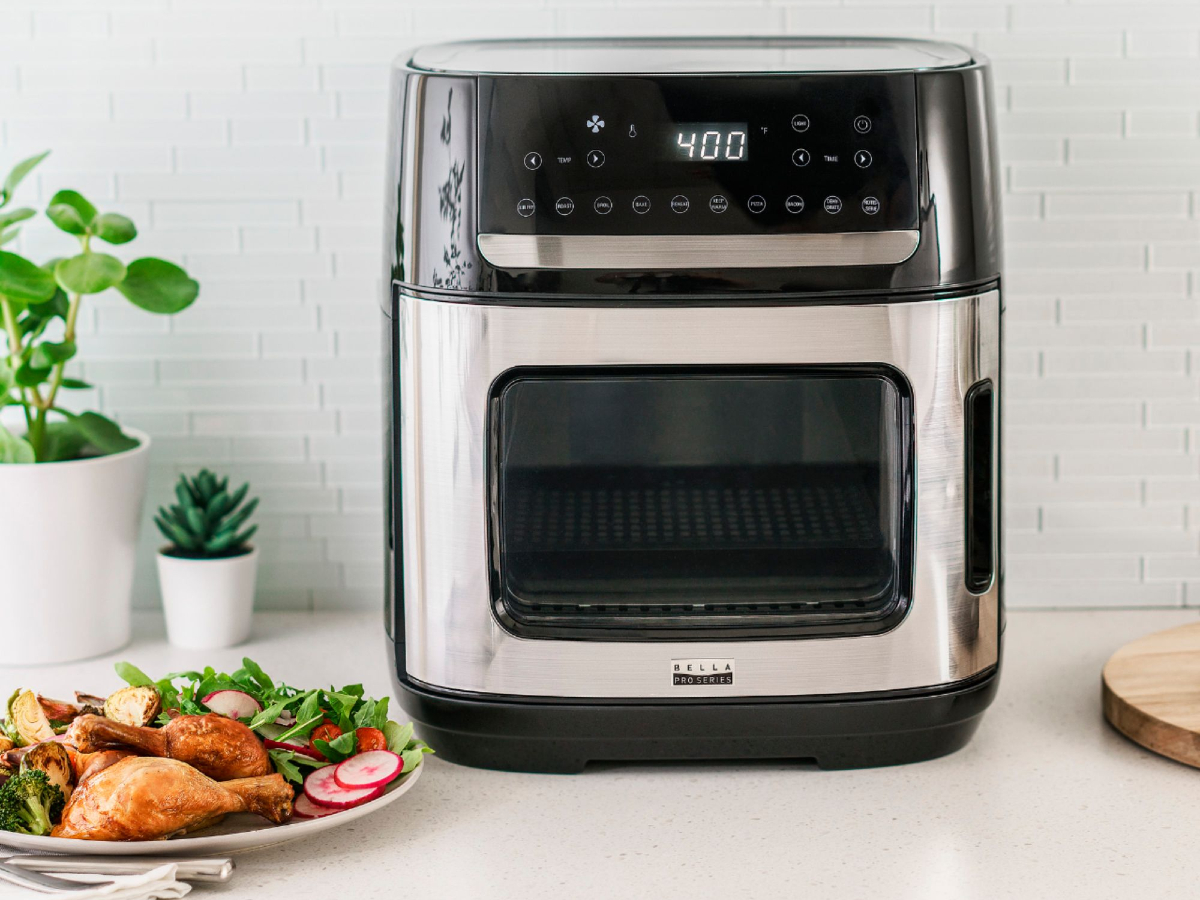 https://www.themanual.com/wp-content/uploads/sites/9/2022/05/bella-pro-12-6-quart-pro-digital-air-fryer-oven-with-a-prepared-meal-of-chicken-drumsticks-and-salad.jpg?fit=800%2C800&p=1