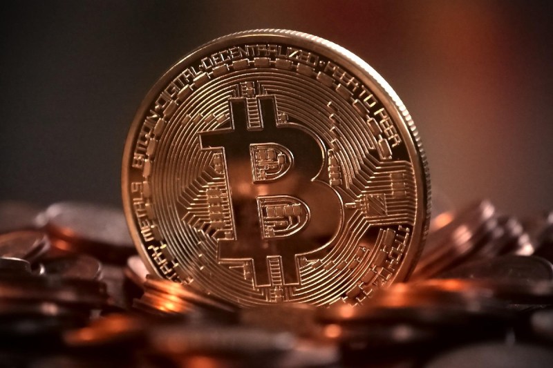 A physical, gold-colored Bitcoin.