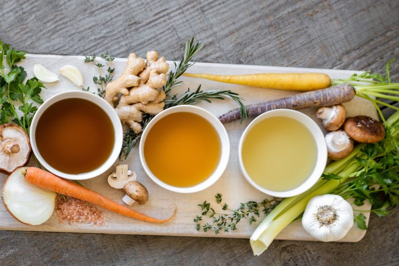 Bowls of bone broth on a tray