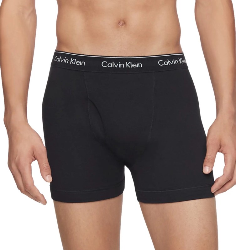 model wearing Calvin Klein boxer briefs on a white background