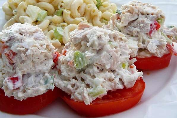 Feta chicken salad on tomato slices with macaroni salad