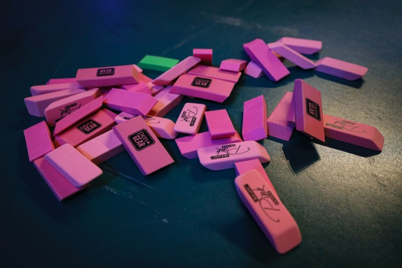 pink rubber erasers in a pile.
