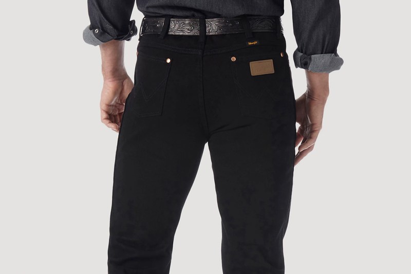 Back pocket details of Wrangler Cowboy cut jeans in black.