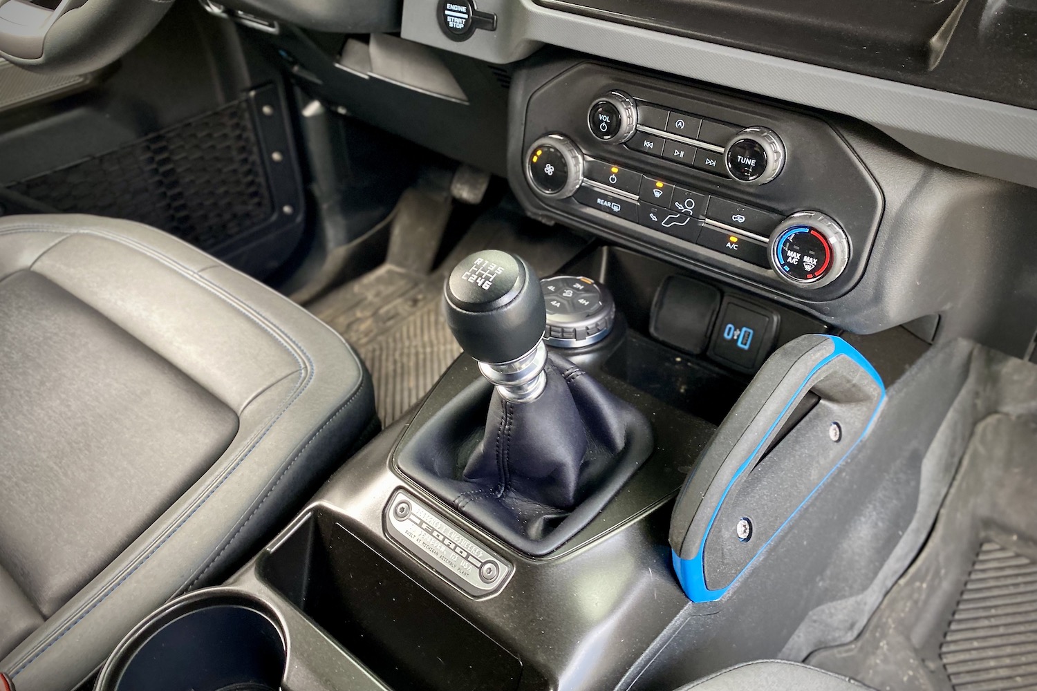 Close up of manual gear shifter in 2021 Ford Bronco from passenger side.