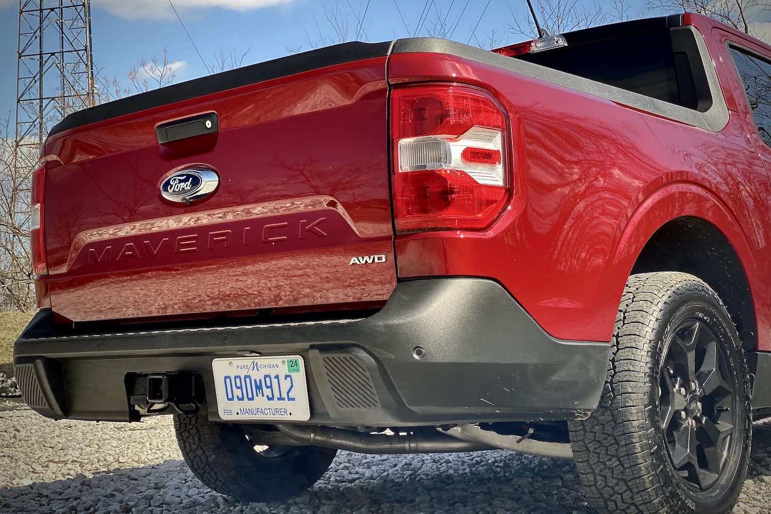 Close up of 2022 Ford Maverick rear end tailgate from passenger side with blue skies in the back.